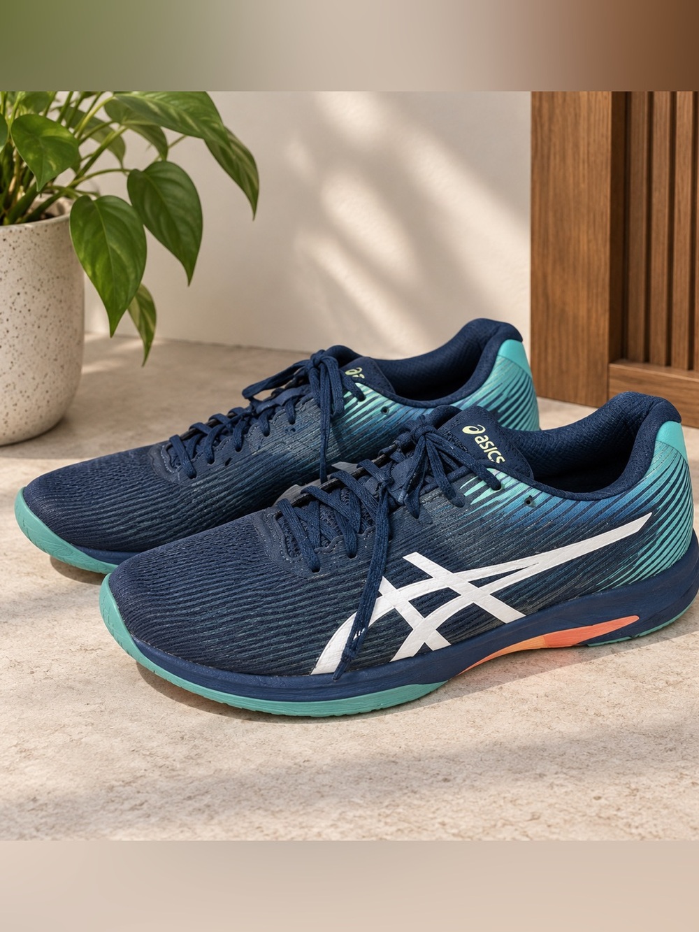 Asics Men’s Navy Blue Running Shoes with Teal and White Accents